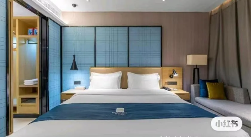 Bed in Echarm Hotel Wuhan Changjiang New District Gaoche Metro Station