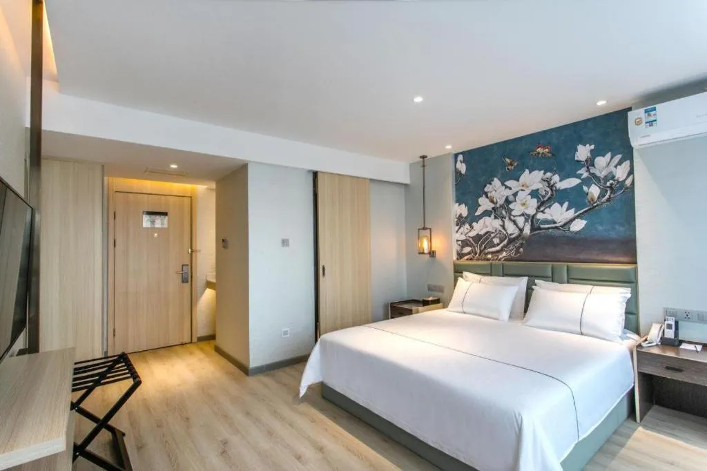 Bed in Magnotel Hotel Suzhou Shiquan Street Wangshiyuan