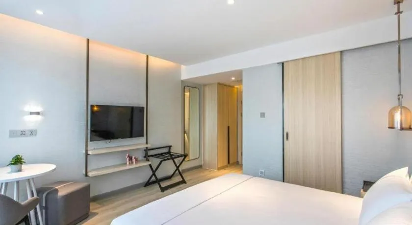 Bed in Magnotel Hotel Suzhou Shiquan Street Wangshiyuan