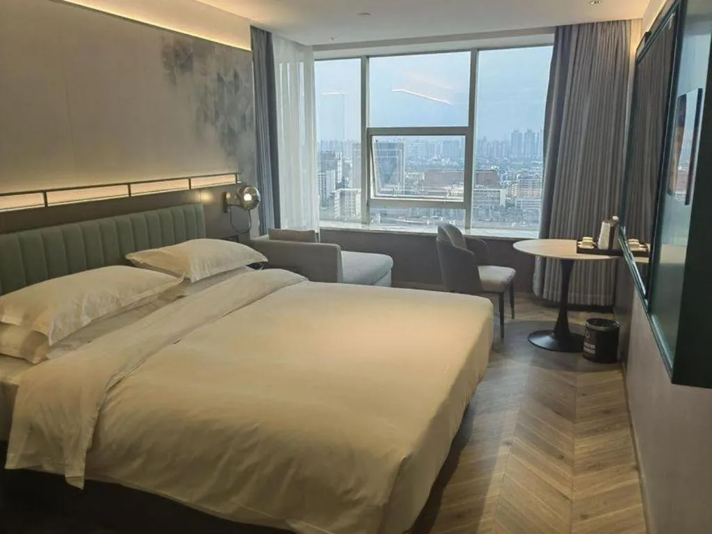 Bed in Borrman Hotel Guangzhou Quzhuang Metro Station