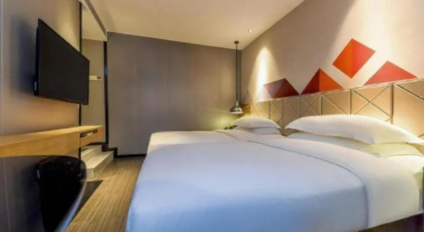 Bed in Borrman Hotel Guangzhou Quzhuang Metro Station
