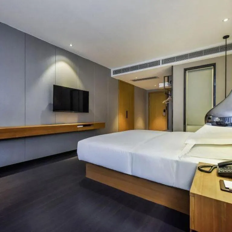 Bed in Borrman Hotel Guangzhou Quzhuang Metro Station