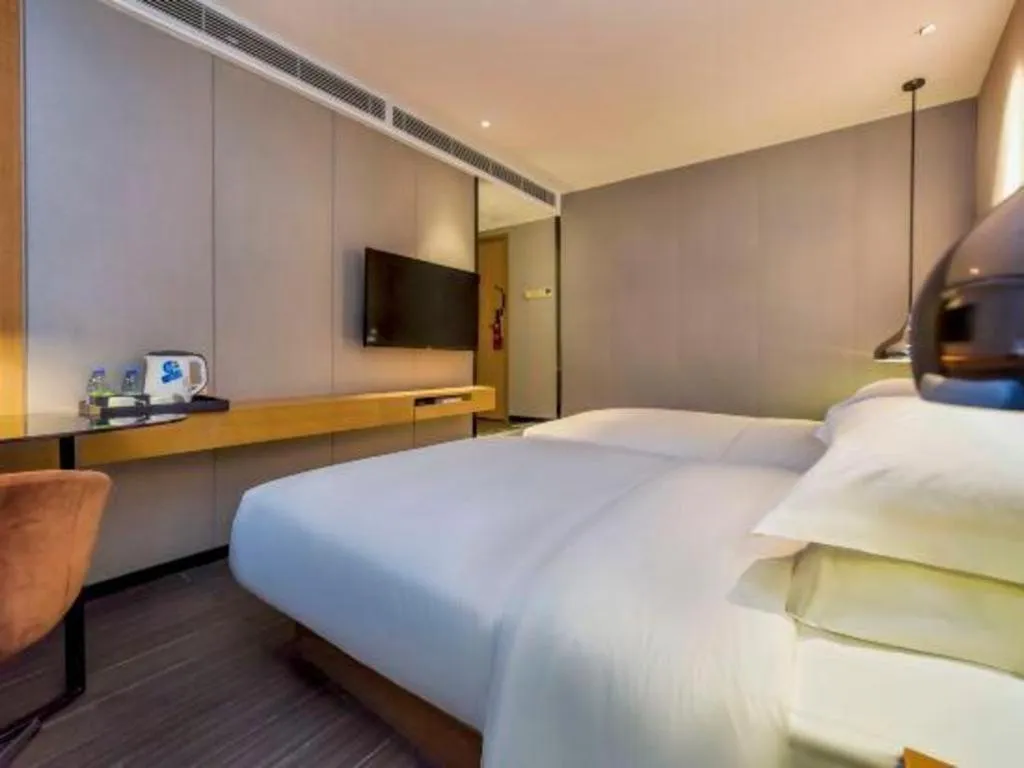 Bed in Borrman Hotel Guangzhou Quzhuang Metro Station