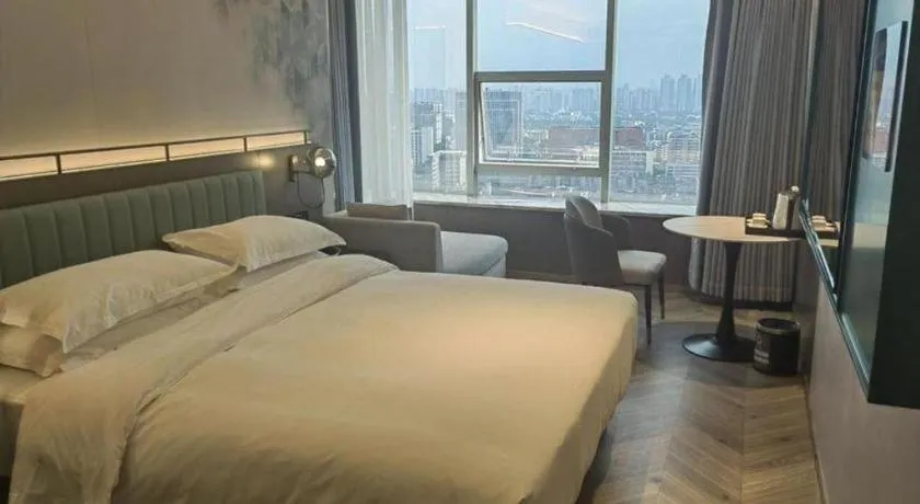 Bed in Borrman Hotel Guangzhou Quzhuang Metro Station