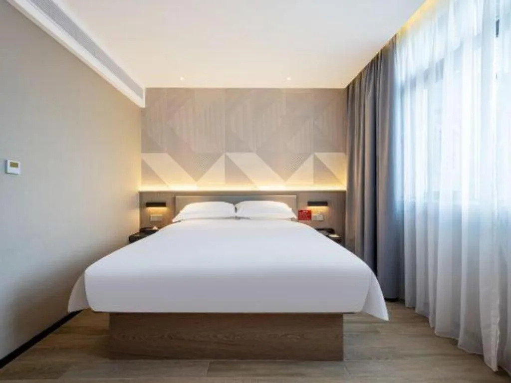 Bed in Borrman Hotel Guangzhou Quzhuang Metro Station