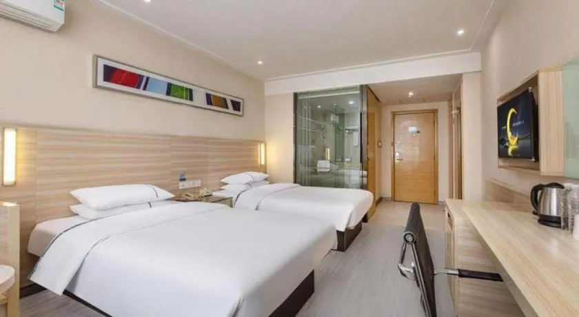 Bed in City Comfort Inn Wuhan Fengshu Er Road Baijin Mansion