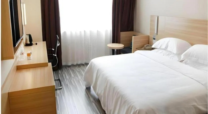 Bed in City Comfort Inn Wuhan Fengshu Er Road Baijin Mansion