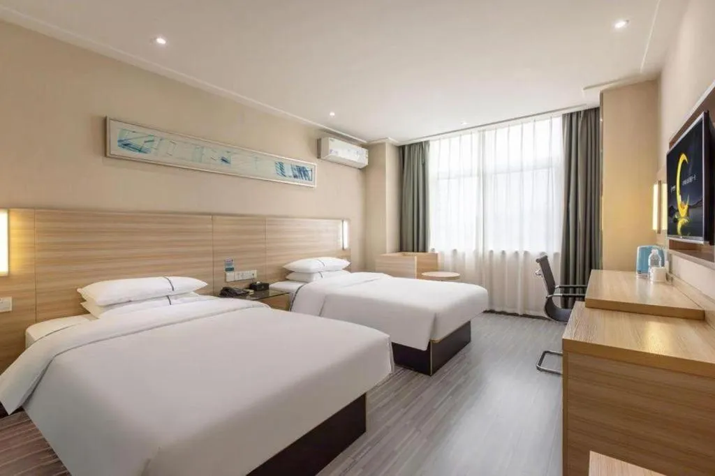 Bed in City Comfort Inn Wuhan Fengshu Er Road Baijin Mansion