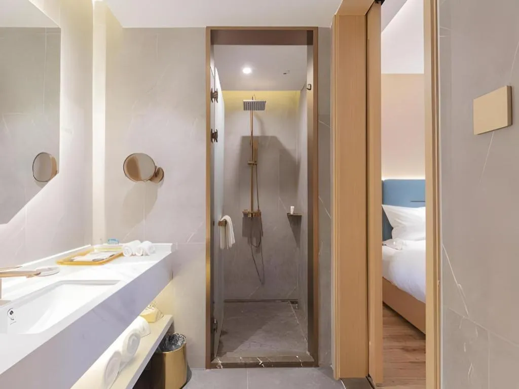 Bed in ZMAX Hotels Shenzhen Lianhuacun Metro Station