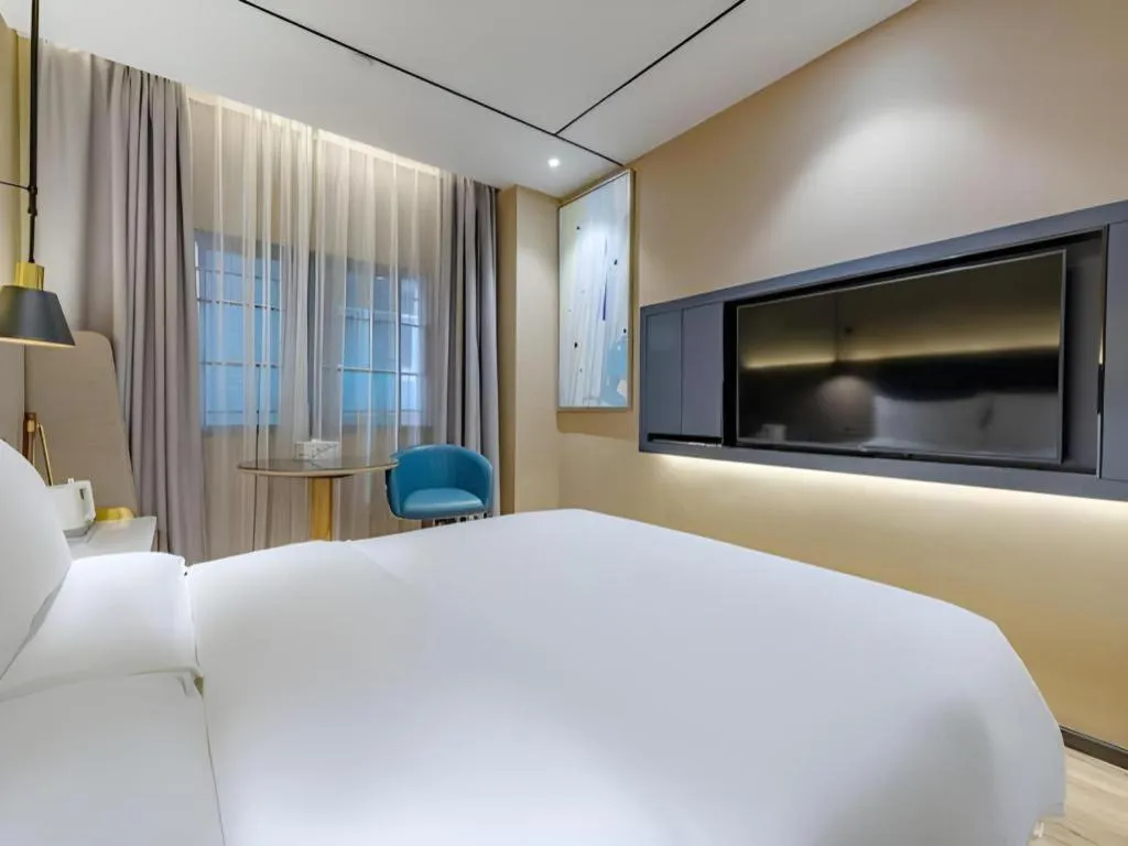 Bed in ZMAX Hotels Shenzhen Lianhuacun Metro Station