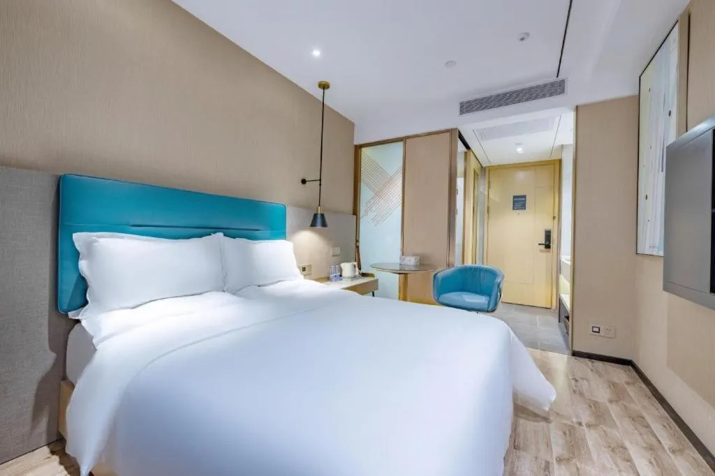 Bed in ZMAX Hotels Shenzhen Lianhuacun Metro Station