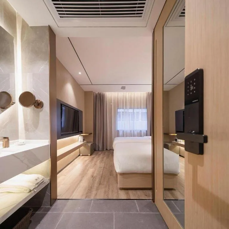 Bed in ZMAX Hotels Shenzhen Lianhuacun Metro Station