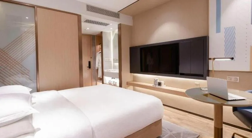 Bed in ZMAX Hotels Shenzhen Lianhuacun Metro Station