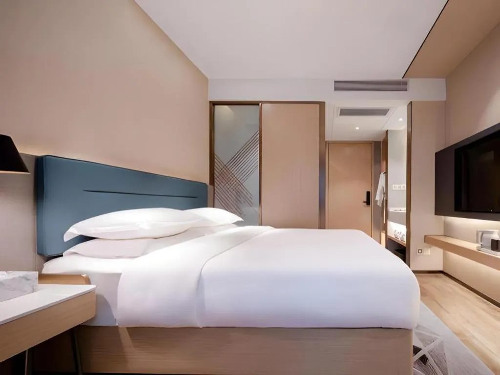 Bed in ZMAX Hotels Shenzhen Lianhuacun Metro Station