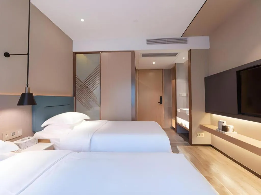 Bed in ZMAX Hotels Shenzhen Lianhuacun Metro Station