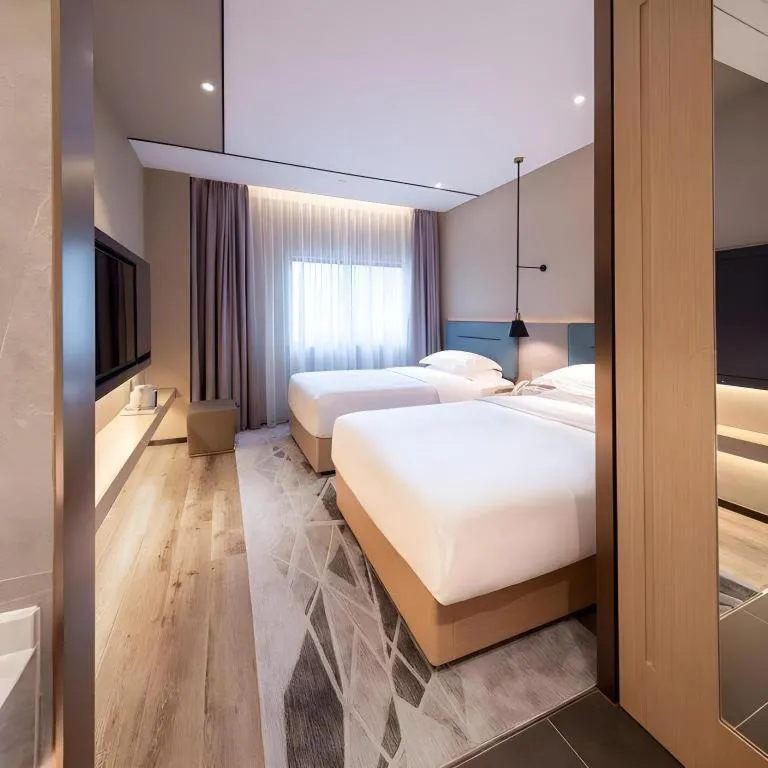 Bed in ZMAX Hotels Shenzhen Lianhuacun Metro Station