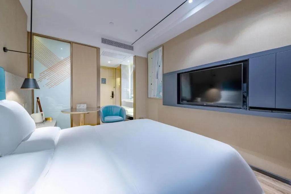 Bed in ZMAX Hotels Shenzhen Lianhuacun Metro Station