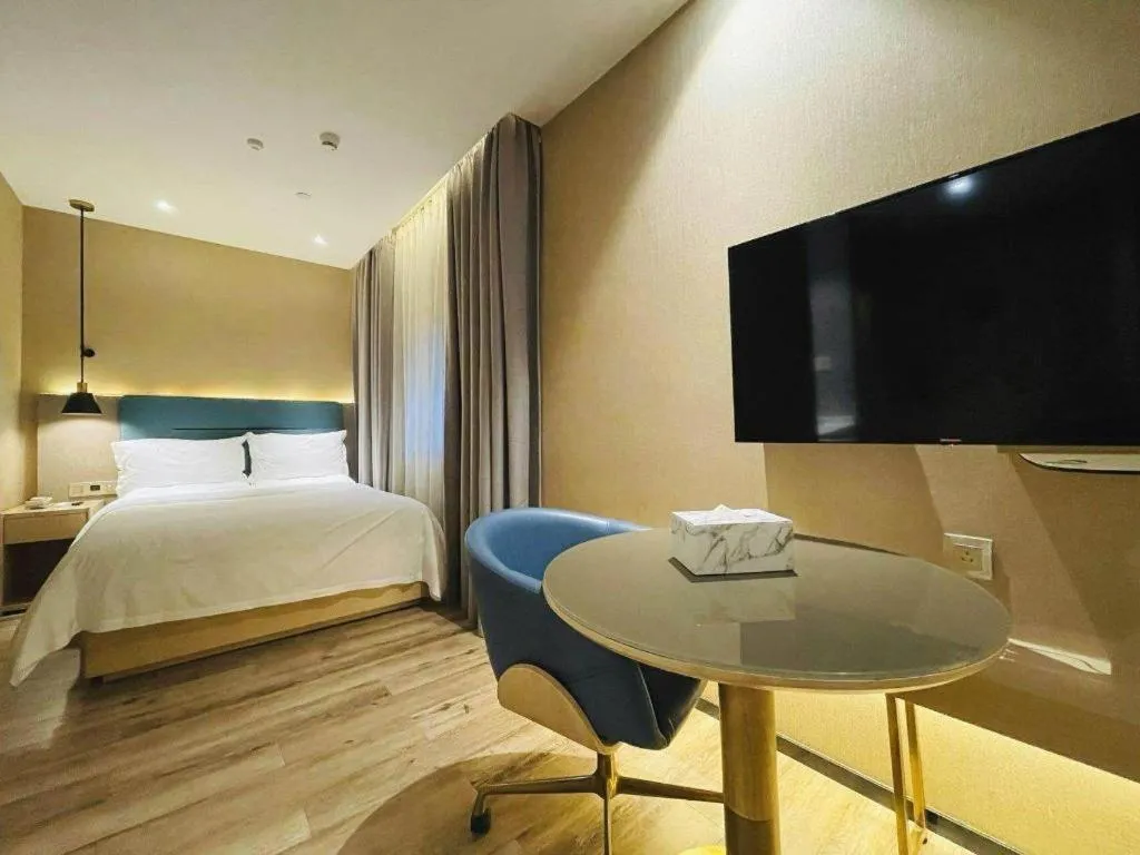 Bed in ZMAX Hotels Shenzhen Lianhuacun Metro Station