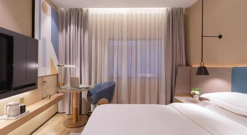 Bed in ZMAX Hotels Shenzhen Lianhuacun Metro Station