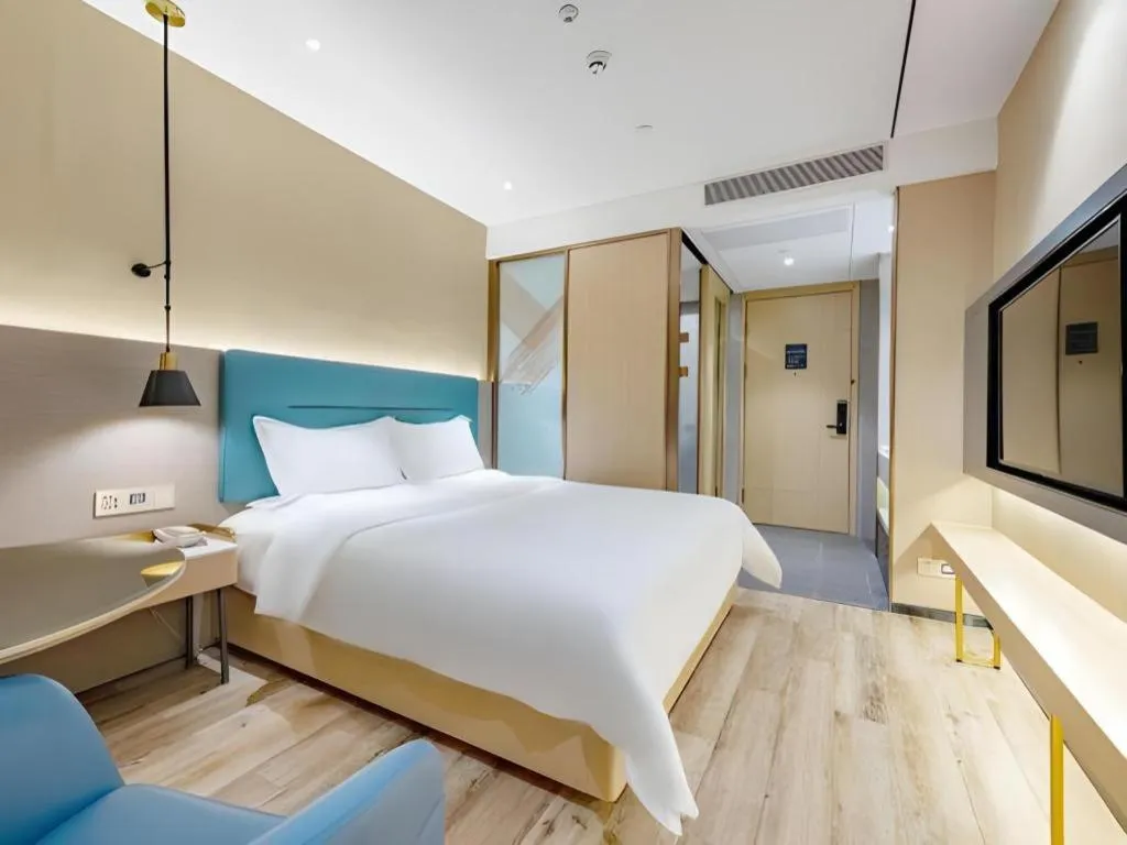 Bed in ZMAX Hotels Shenzhen Lianhuacun Metro Station