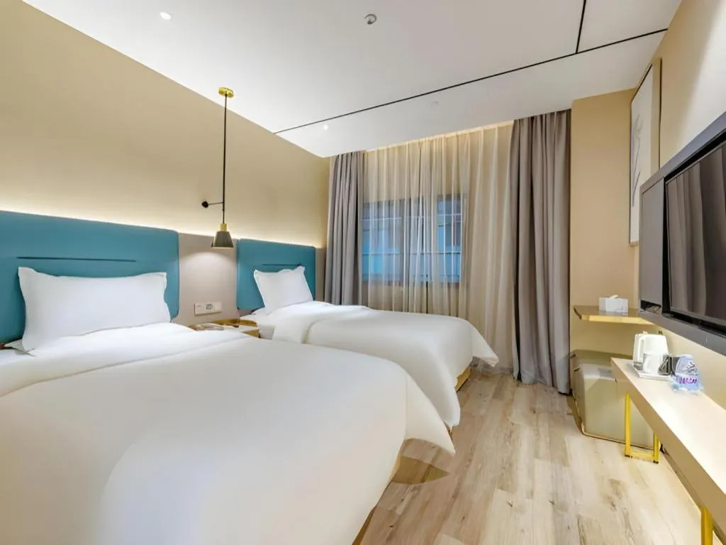 Bed in ZMAX Hotels Shenzhen Lianhuacun Metro Station