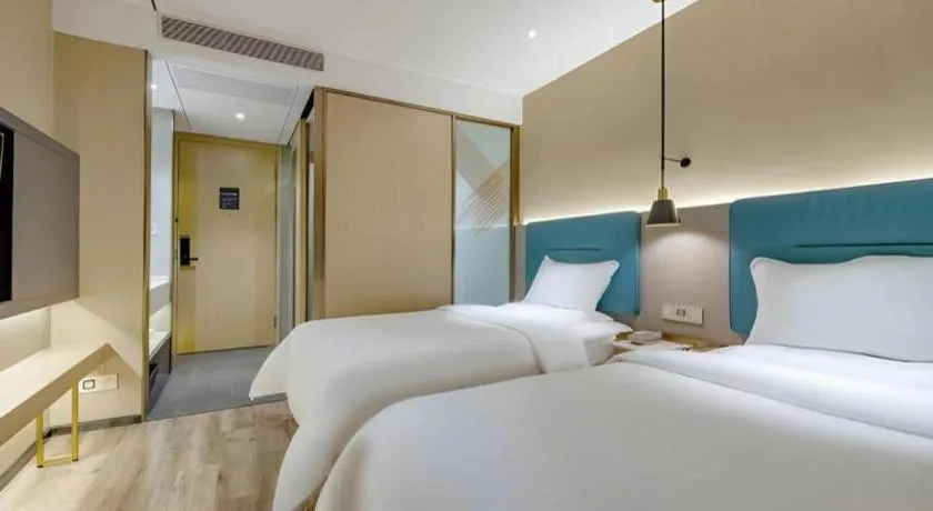 Bed in ZMAX Hotels Shenzhen Lianhuacun Metro Station