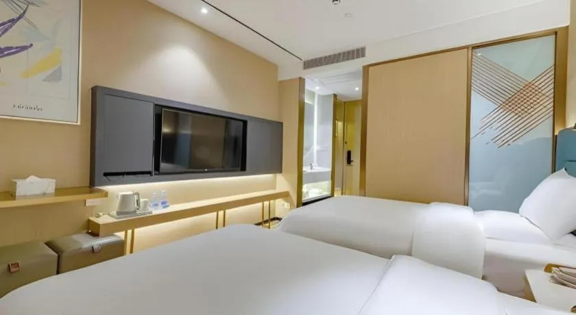 Bed in ZMAX Hotels Shenzhen Lianhuacun Metro Station