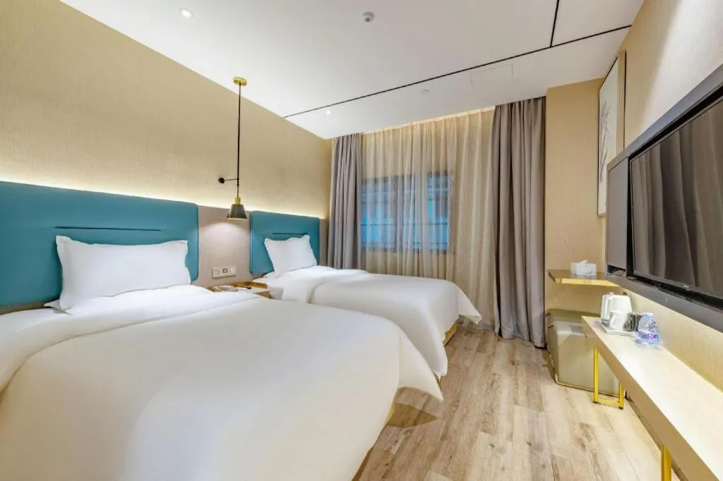 Bed in ZMAX Hotels Shenzhen Lianhuacun Metro Station