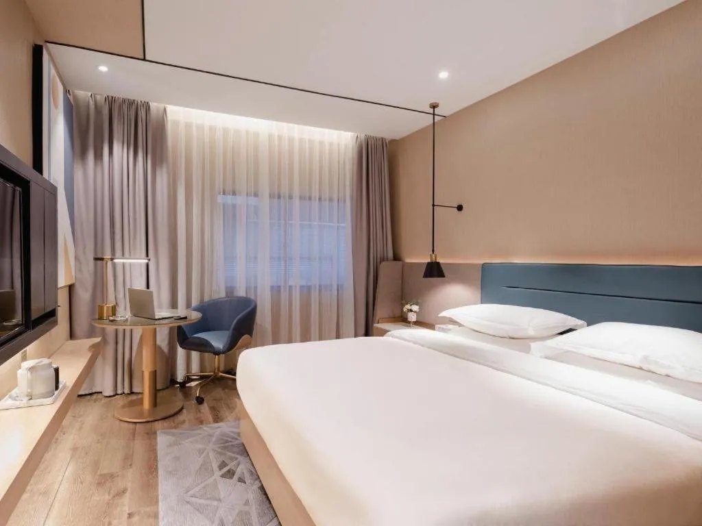 Bed in ZMAX Hotels Shenzhen Lianhuacun Metro Station