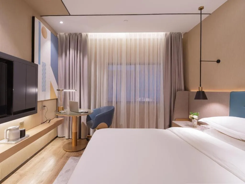 Bed in ZMAX Hotels Shenzhen Lianhuacun Metro Station