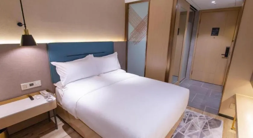Bed in ZMAX Hotels Shenzhen Lianhuacun Metro Station