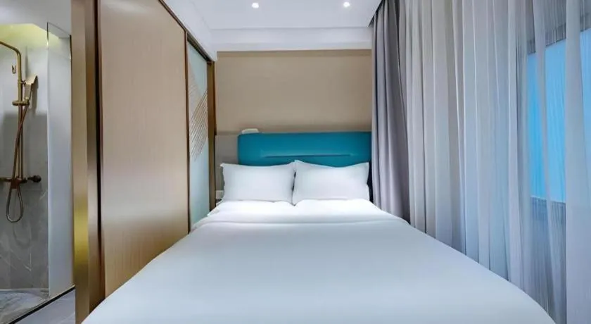 Bed in ZMAX Hotels Shenzhen Lianhuacun Metro Station