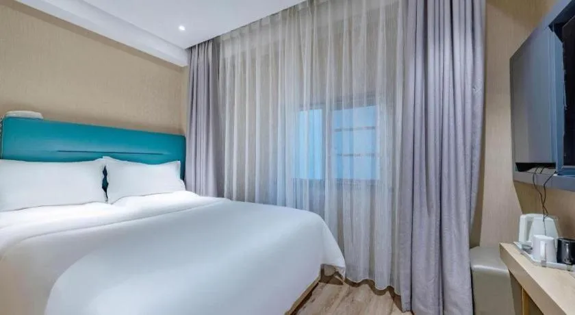 Bed in ZMAX Hotels Shenzhen Lianhuacun Metro Station