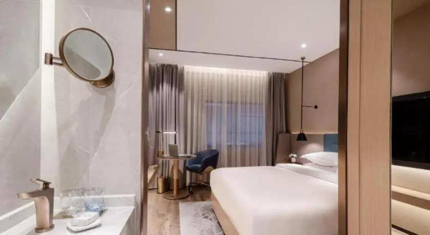 Bed in ZMAX Hotels Shenzhen Lianhuacun Metro Station