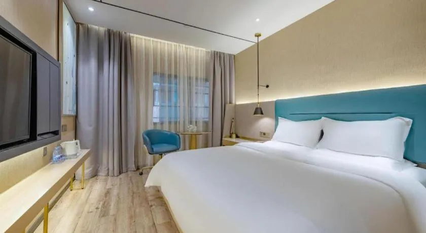 Bed in ZMAX Hotels Shenzhen Lianhuacun Metro Station