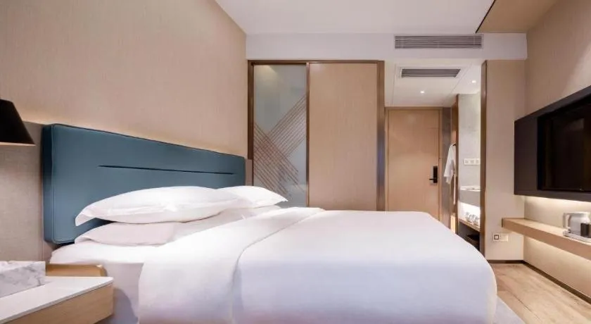 Bed in ZMAX Hotels Shenzhen Lianhuacun Metro Station