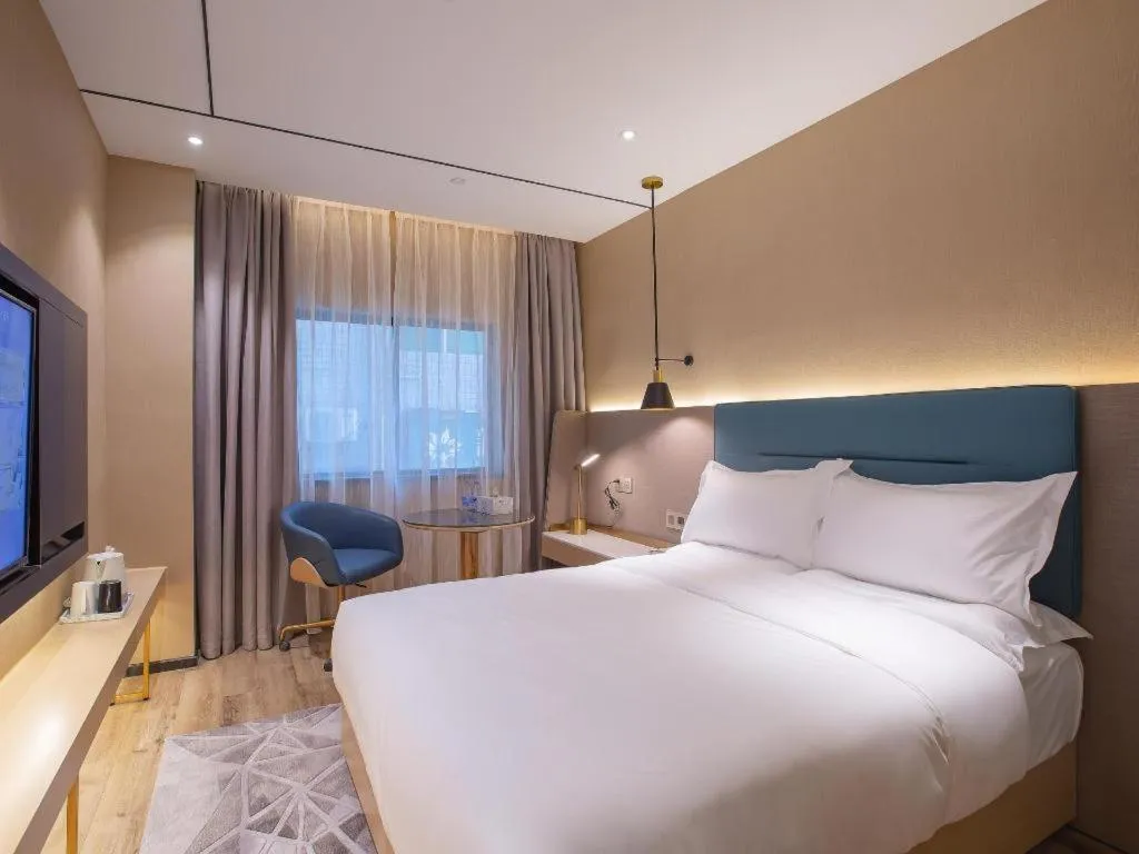 Bed in ZMAX Hotels Shenzhen Lianhuacun Metro Station