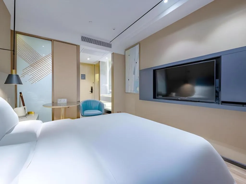 Bed in ZMAX Hotels Shenzhen Lianhuacun Metro Station