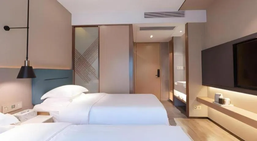 Bed in ZMAX Hotels Shenzhen Lianhuacun Metro Station