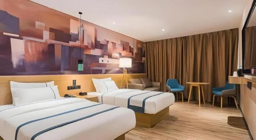 Bed in City Comfort Inn Dongguan Wangniudun
