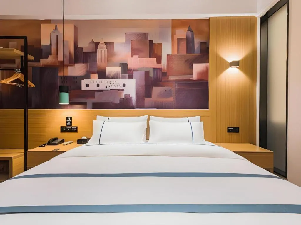 Bed in City Comfort Inn Dongguan Wangniudun