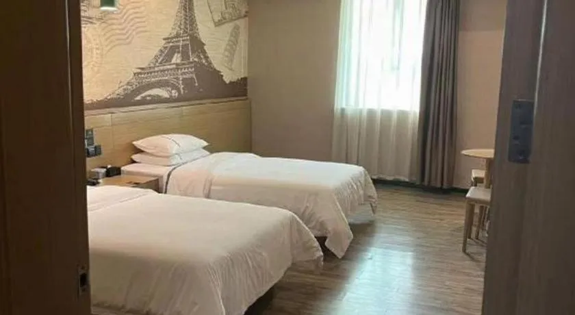 Bed in City Comfort Inn Dongguan Wangniudun