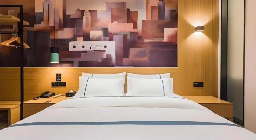 Bed in City Comfort Inn Dongguan Wangniudun