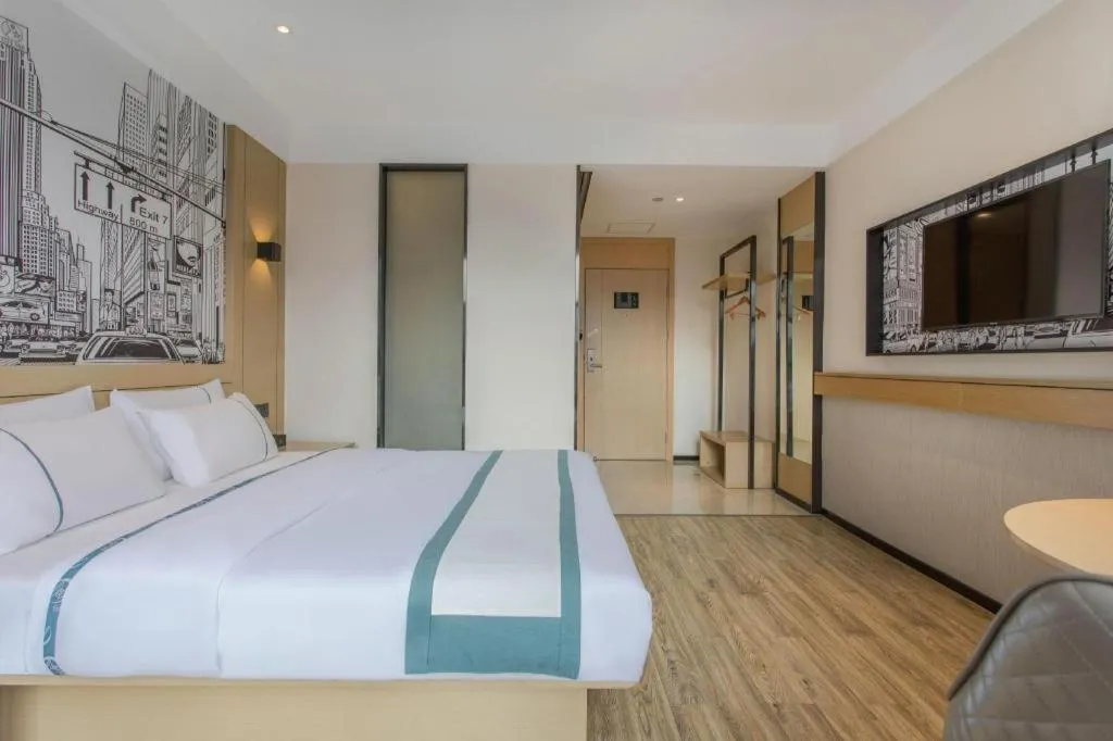 Bed in City Comfort Inn Dongguan Wangniudun