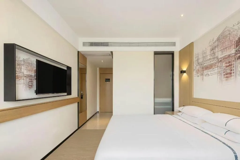 Bed in City Comfort Inn Dongguan Wangniudun