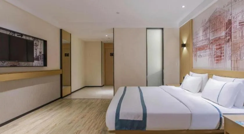 Bed in City Comfort Inn Dongguan Wangniudun