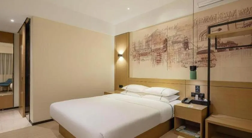 Bed in City Comfort Inn Dongguan Wangniudun