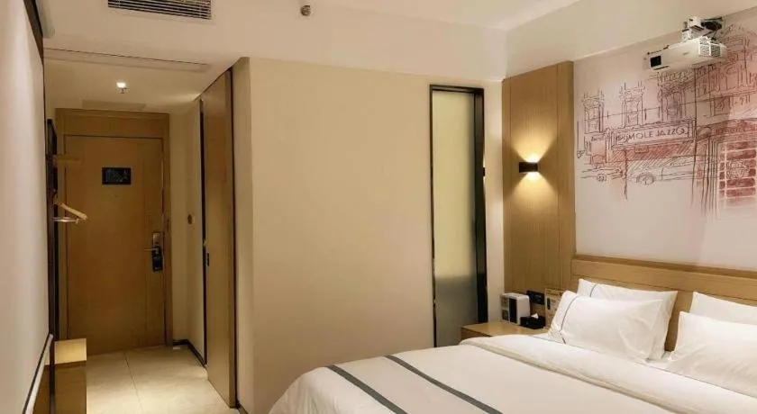 Bed in City Comfort Inn Dongguan Wangniudun