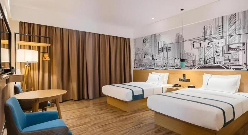 Bed in City Comfort Inn Dongguan Wangniudun