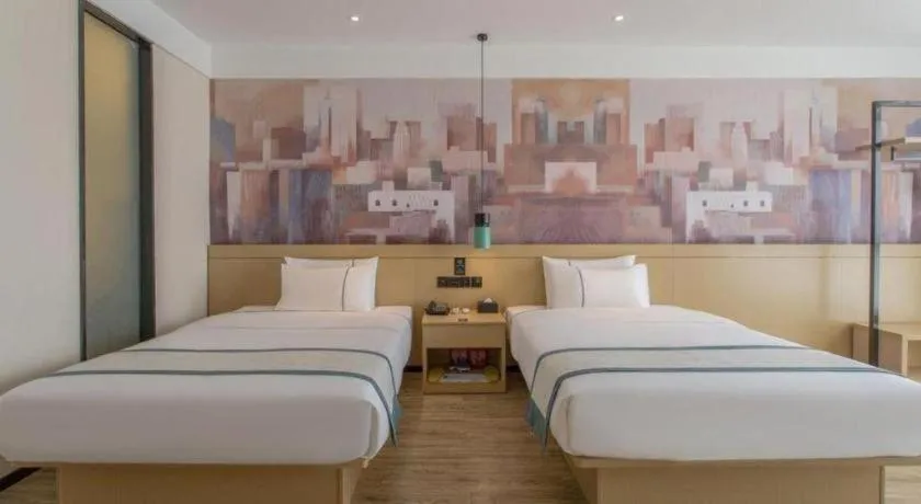 Bed in City Comfort Inn Dongguan Wangniudun